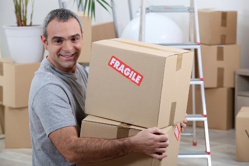 Moving boxes and furniture prepared for a Golders Green removal service
