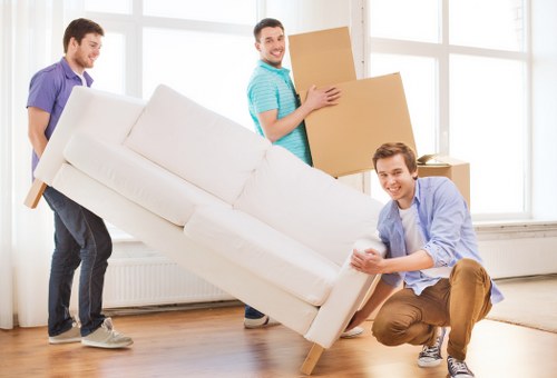 Removal team packing and loading household items for a Goldersgreen house move