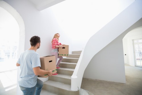 Worker using safe manual handling techniques during a removal