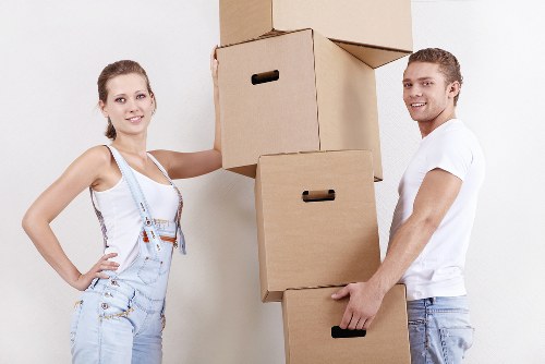 Experienced house removalists unloading furniture at a new Goldersgreen home