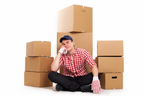 Professional movers handling furniture on moving day in Golders Green